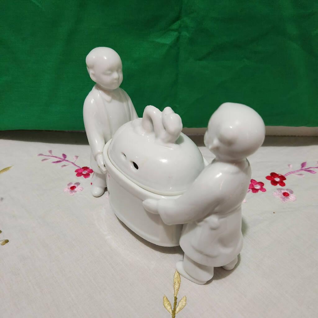 Andrea Sadek Made in Japan Porcelain White Incense burner Carried by two Boys